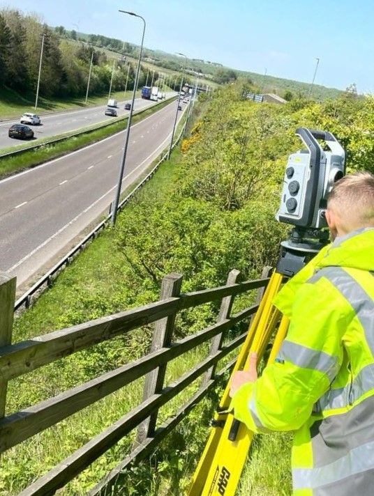 Topographical Surveyor, surveying busy road