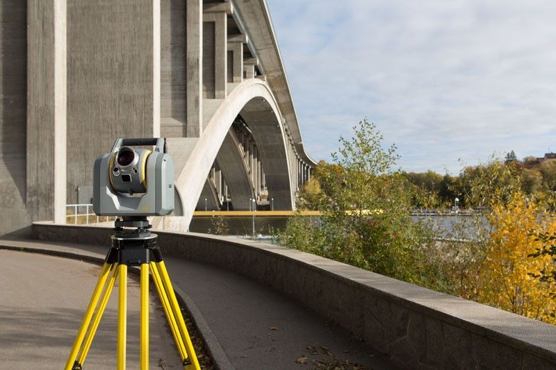 Surveying camera equipment at bridge